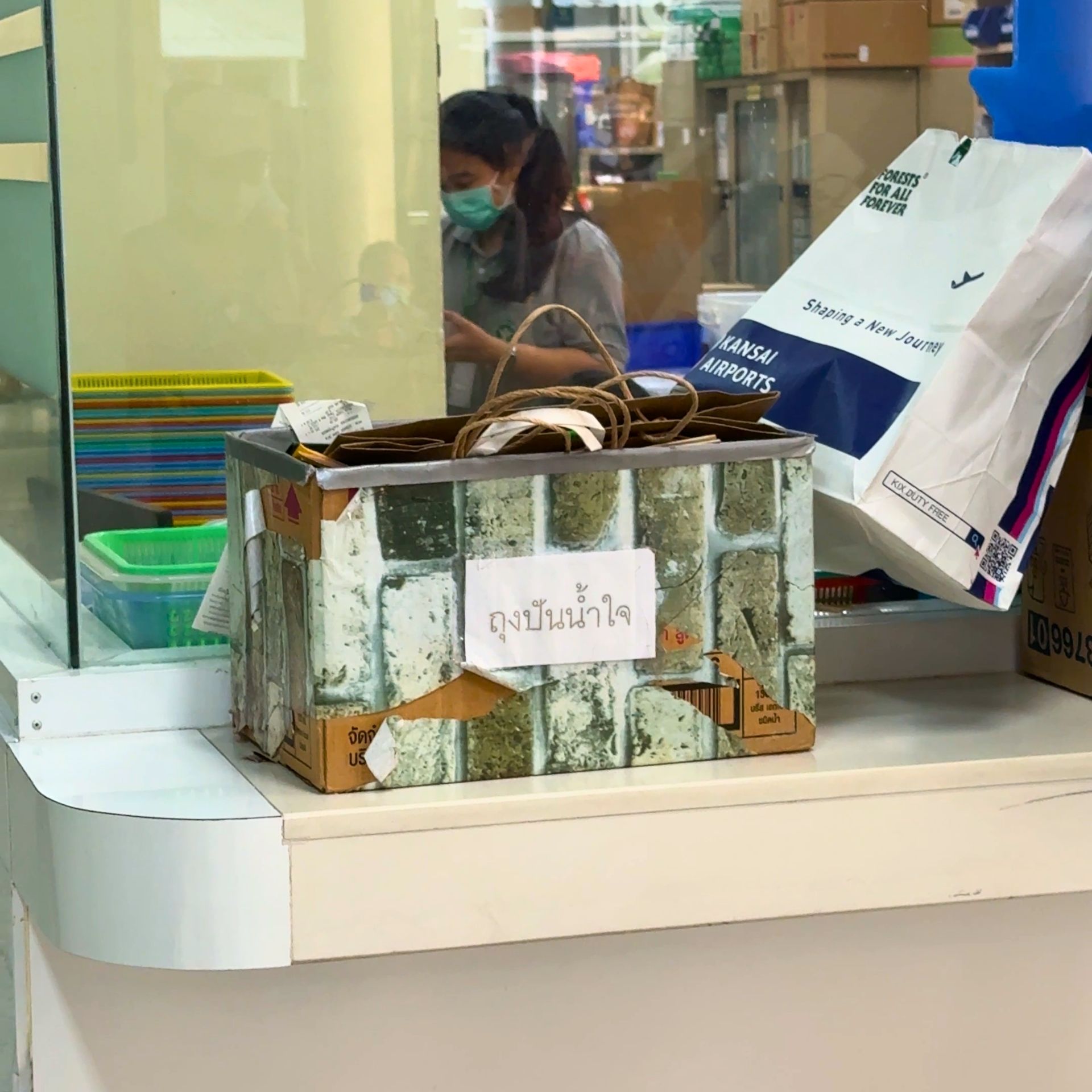 KPX Chemical Thailand staff donating paper bags to Samut Prakan Hospital for the Go Green plastic reduction campaign.